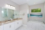 The Master Bathroom with Dual Sinks, Soaking Tub and Walk in Shower